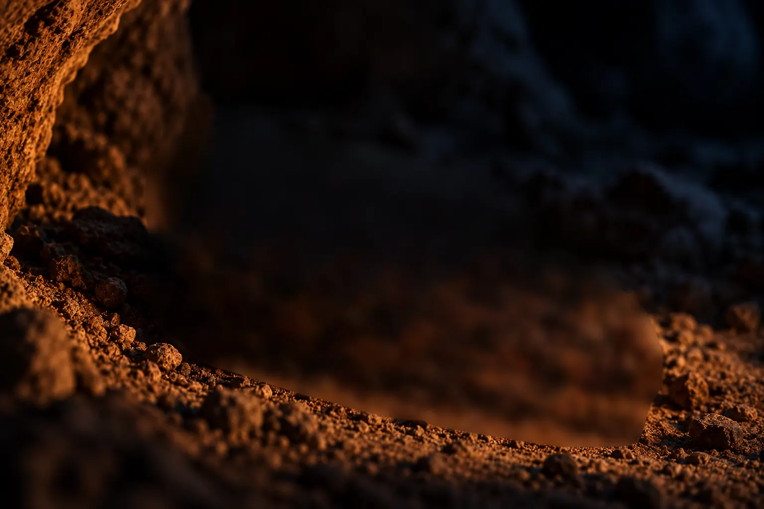 A small piece of red ochre engraved with a cross-hatched pattern.